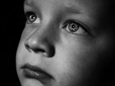 sad boy in black and white picture